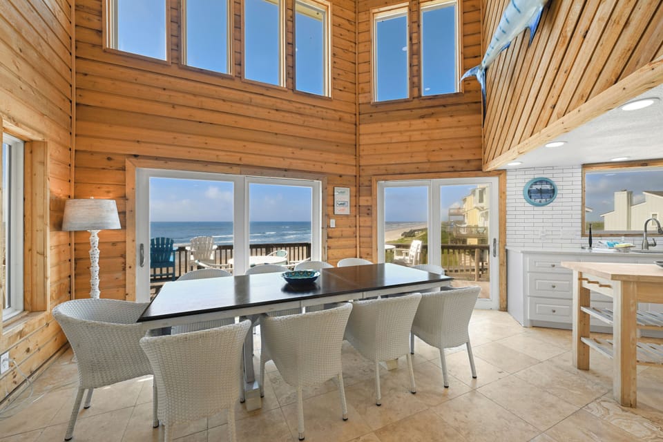 Picture yourself dining here, surrounded by soaring wood-paneled walls and sunlight streaming through expansive windows. Your oceanfront table offers breathtaking coastal views, making every meal feel like a celebration of the sea.