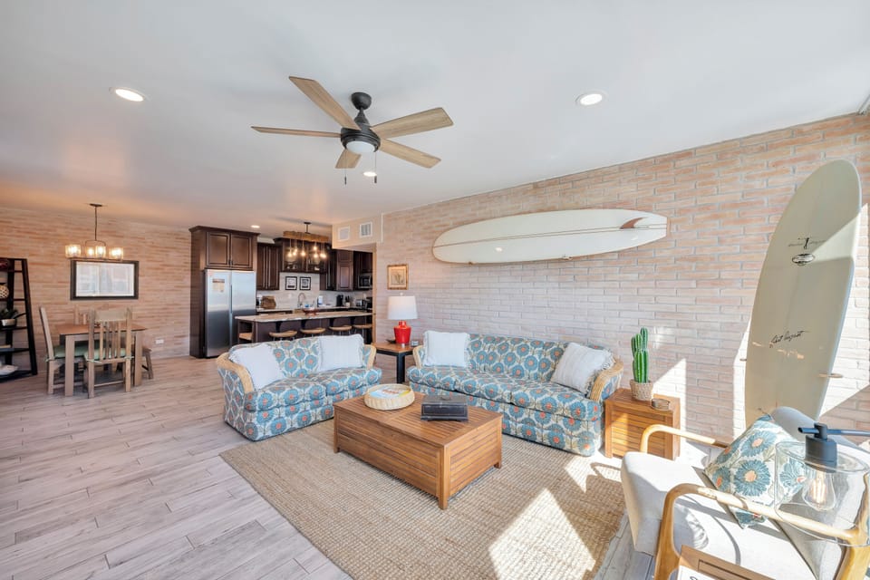Your coastal-inspired living space features comfortable seating and an open kitchen, perfect for relaxing after beach days.