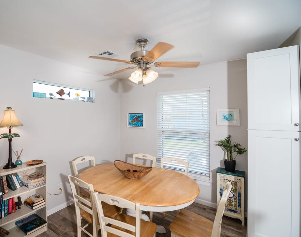 Gather around this welcoming dining table where you'll share memorable meals with loved ones in bright, coastal-inspired comfort.