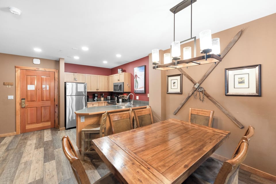 Gather around your spacious dining table while the full kitchen awaits your culinary adventures, complete with modern appliances and warm mountain lodge charm.