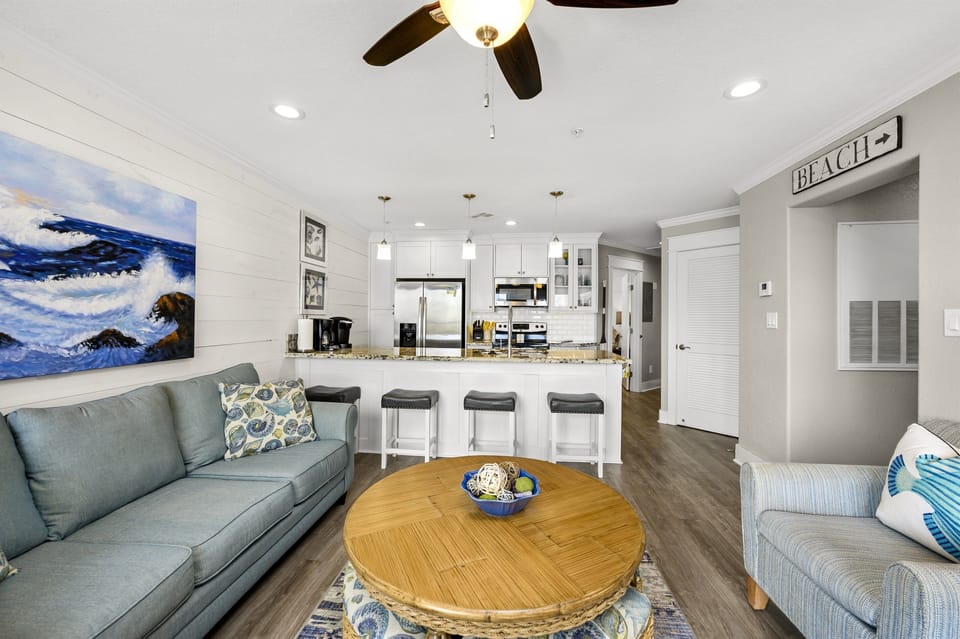 Open den and kitchen with ample seating.