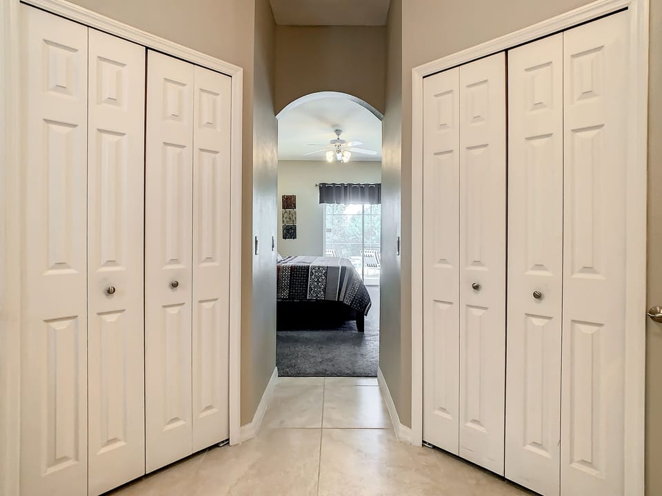 Master closets separating master bedroom and bath