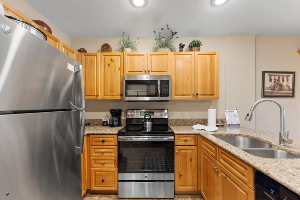 Your fully equipped kitchen features stainless steel appliances, granite counters, and warm wood cabinets for memorable meal prep.