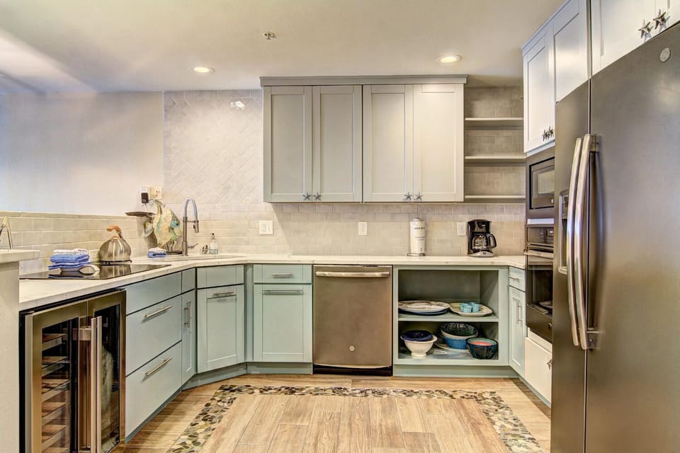 Your fully-equipped kitchen features modern appliances and ample counter space for preparing memorable meals during your stay.