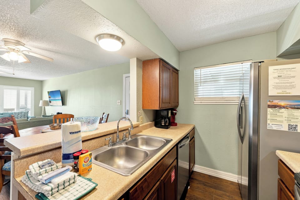 Your fully-equipped kitchen awaits with a double sink, modern appliances, and everything you need to prepare meals in comfort during your stay.