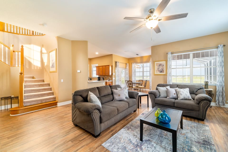 Living Room showing beginning of staircase to 2nd floor