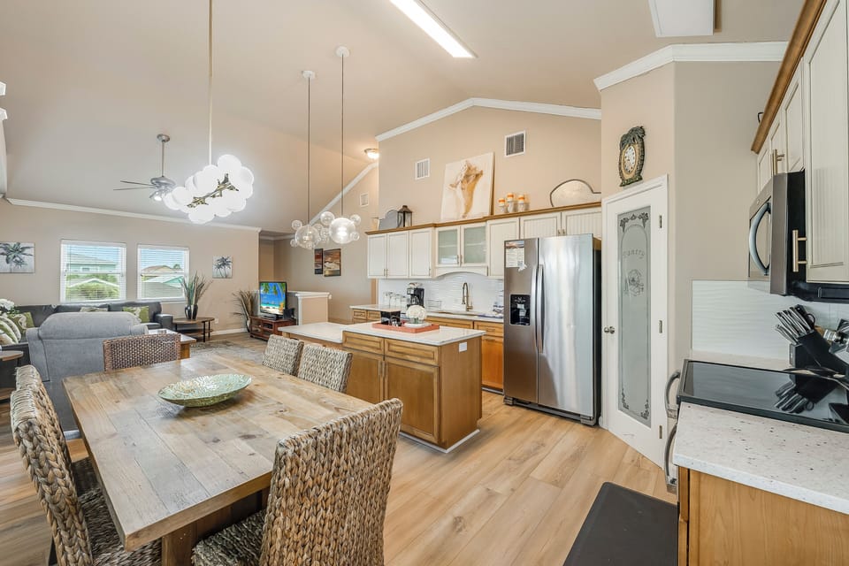 Kitchen looking into living area - The kitchen, dining, and living areas blend seamlessly for a bright and airy feel