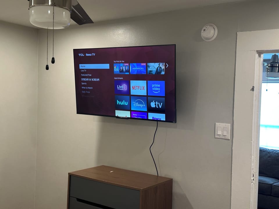 50” Roku TV in bedroom.