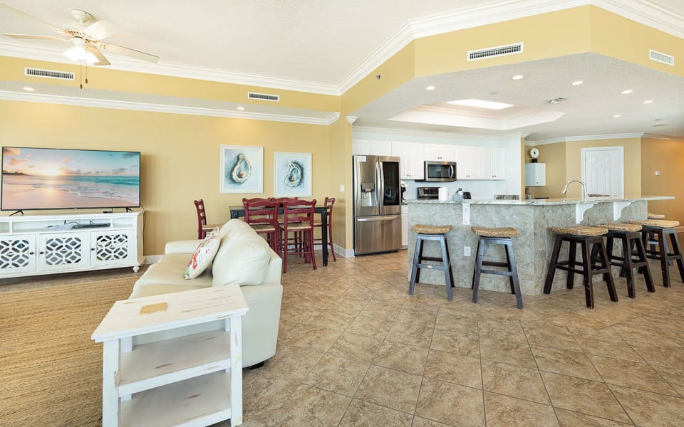 The living room offers a soft couch to sink into as you watch a favorite movie with family nearby