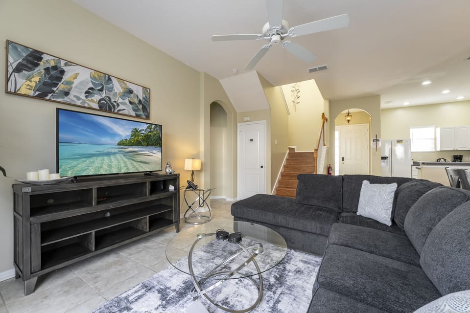 Living room showing sofa with chaise, TV
