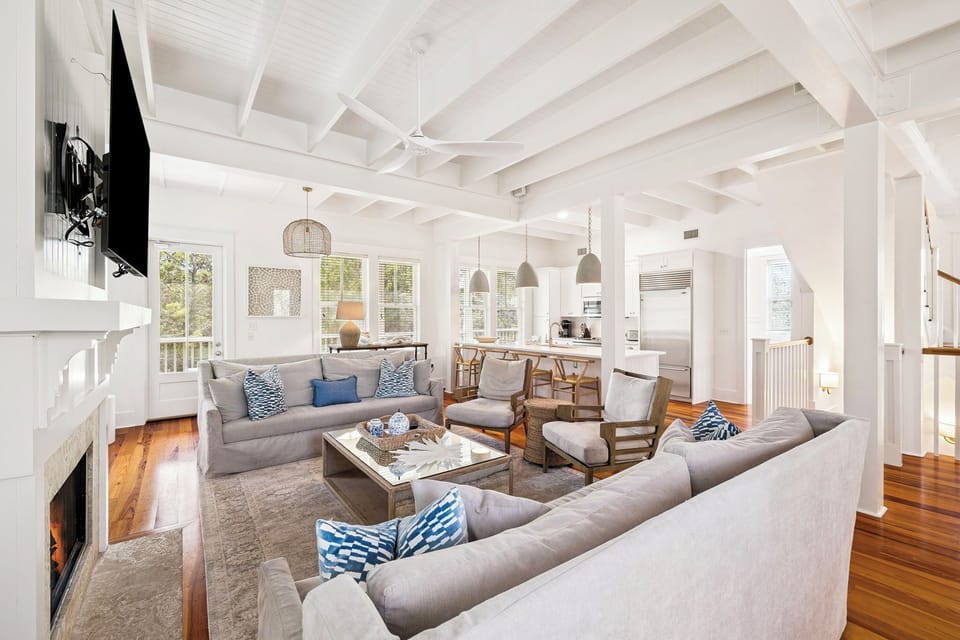 Unwind in your bright, open living space with vaulted ceilings, cozy fireplace, and beautiful hardwood floors throughout.