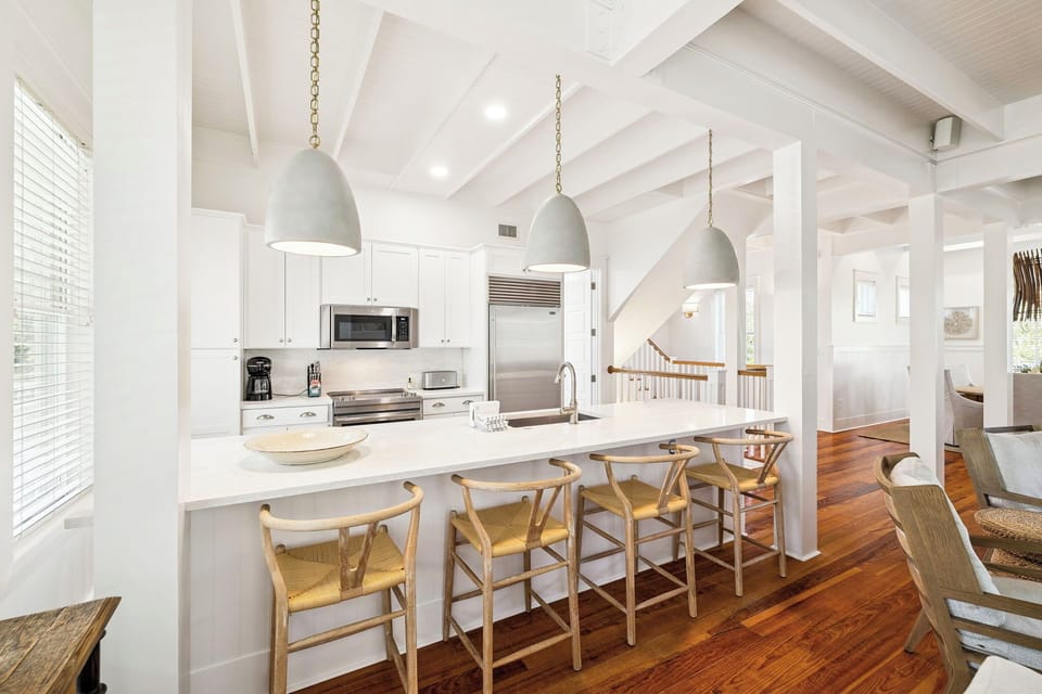 Your modern kitchen island becomes the heart of your stay, with sleek pendant lights illuminating a space perfect for morning coffee and evening conversations.