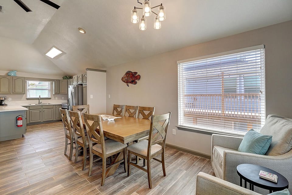 Gather around your spacious dining table for memorable meals while soaking in stunning views through the large window.