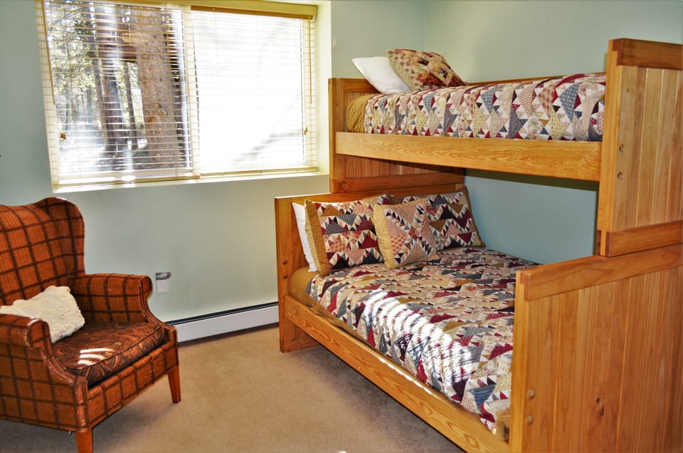 Third Bedroom - The third bedroom is located downstairs and has a captain's bunk. It has a shared bathroom with the second bedroom.