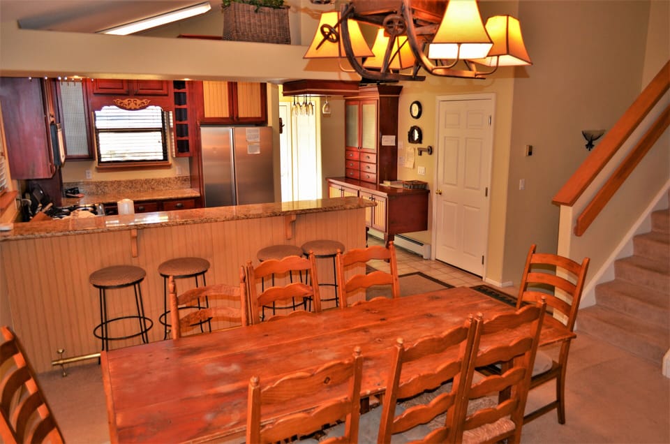 Fully Equipped Kitchen and Dining Area - The fully equipped kitchen and dining room area open up to each other making the main level very spacious. The dining room area is very large, which makes it big enough for the entire party and guests.