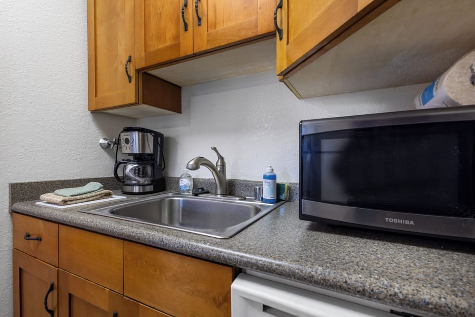 Your kitchenette comes ready with a microwave, coffee maker, and fresh sink—everything you need to make quick meals or enjoy morning coffee in comfort.