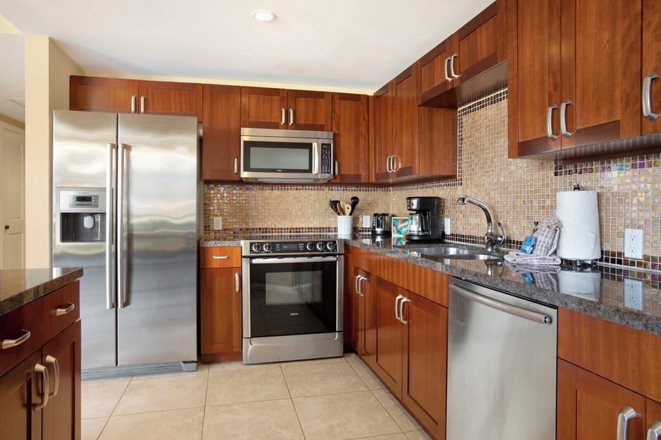 Enjoy the convenience of stainless steel appliances, rich wood cabinetry, and everything you need to cook in comfort