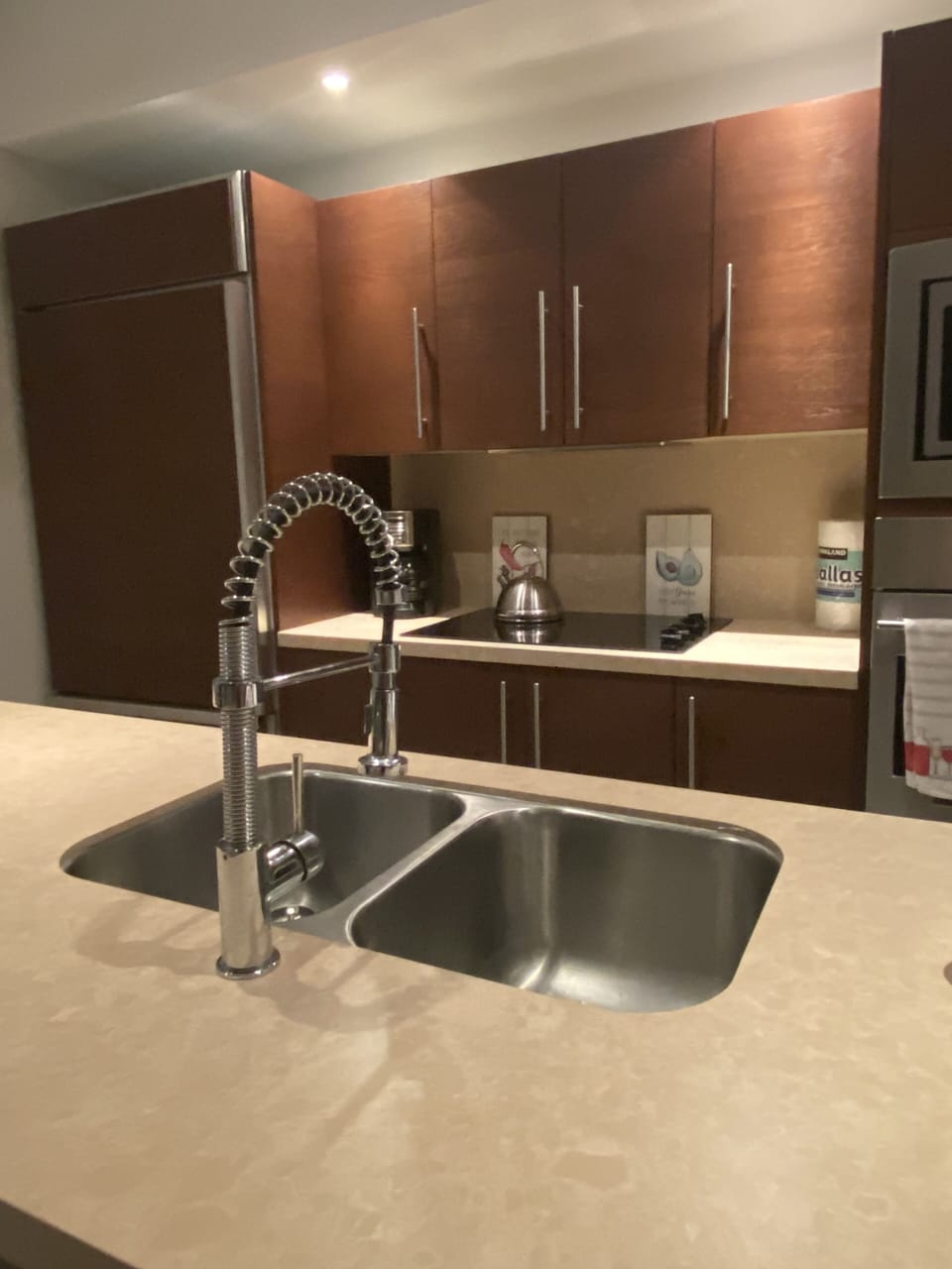 Kitchen with all the amenities, overlooking the pools and palm trees