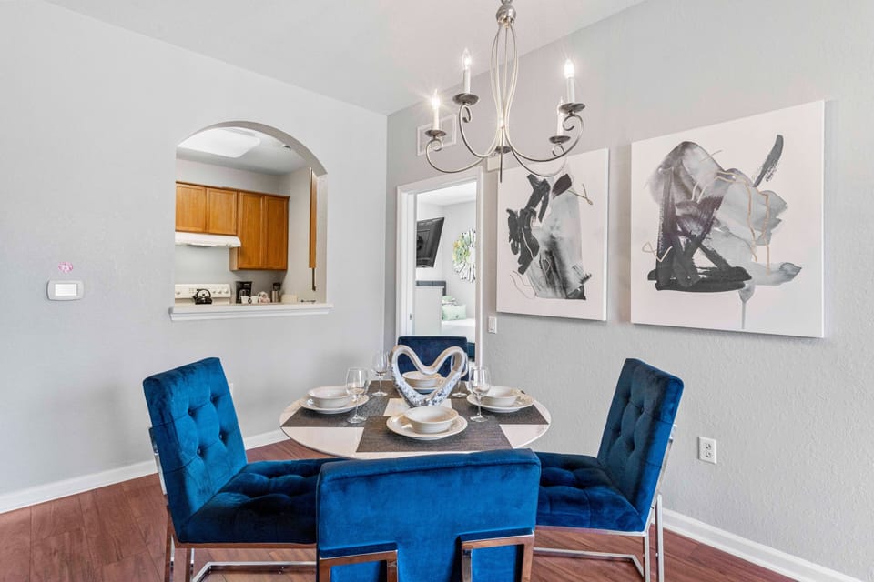 The elegant dining area, adorned with exquisite lights and fixtures, exudes refined charm and timeless beauty.