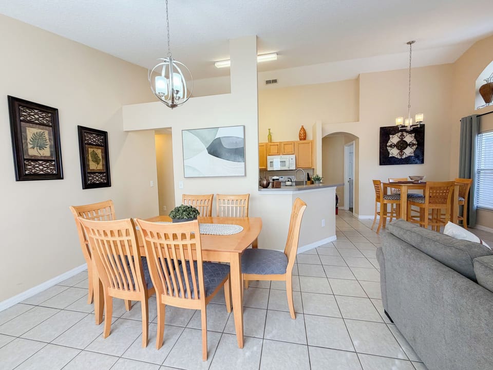Bright and spacious open concept layout featuring a dining table for family meals, a second dining nook, and easy flow into the kitchen and living space, perfect for gathering, entertaining, and relaxing together.