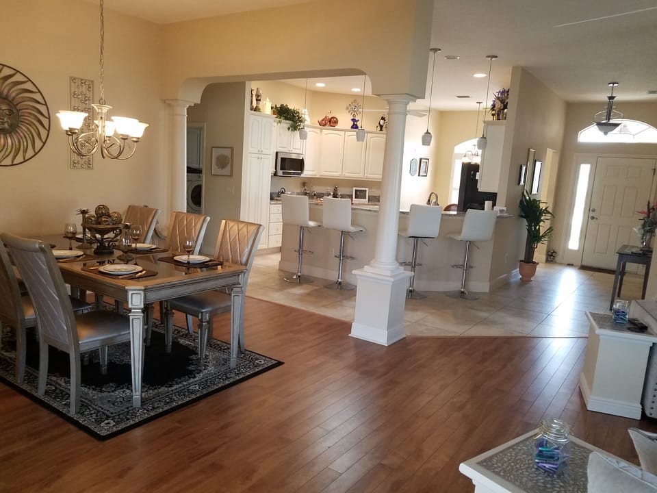 View from living room looking into dining area and kitchen.