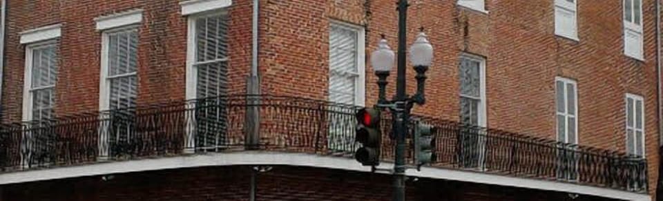 Wrap-around balcony overlooking the corner of St. Charles Ave. and Julia Street.