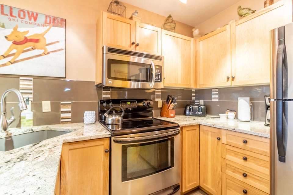 Your fully equipped kitchen awaits with granite counters, stainless appliances, and everything needed to create memorable meals during your stay.