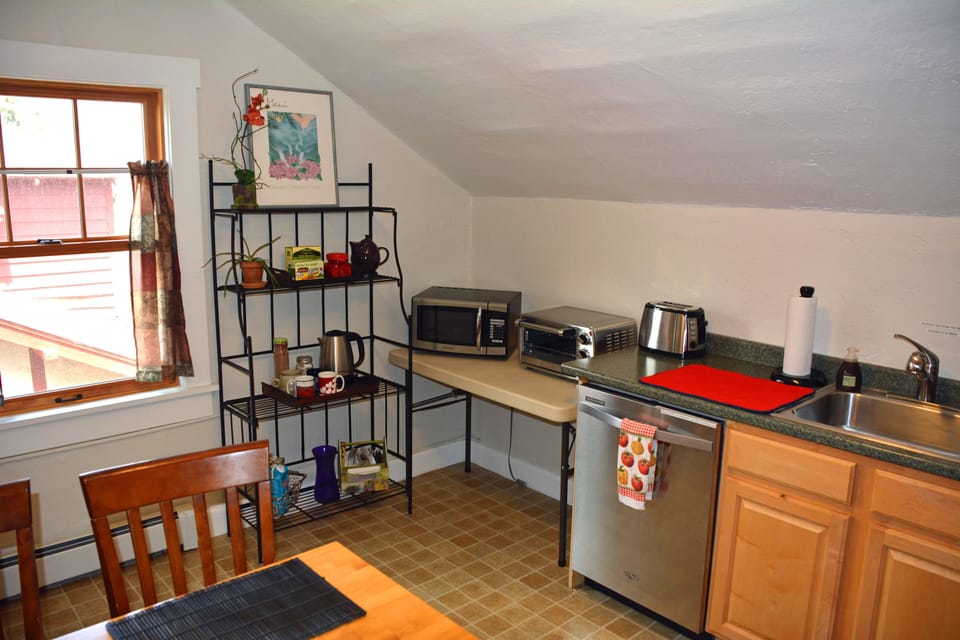 Kitchenette w/ microwave, toaster and toaster oven, coffee maker, fridge, etc. 