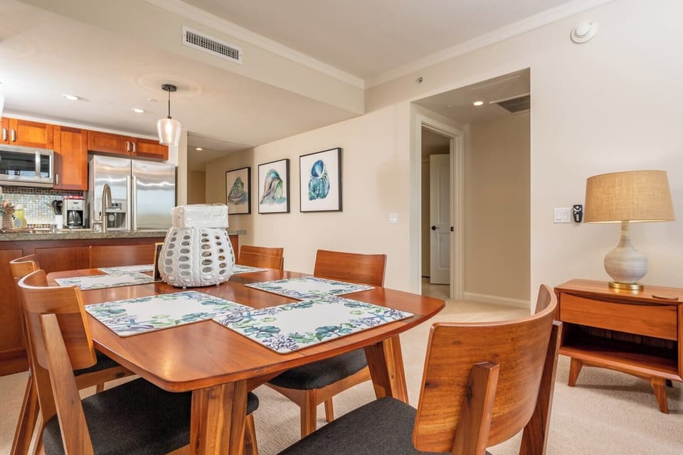 Gather around coastal elegance in this warm, inviting dining space.