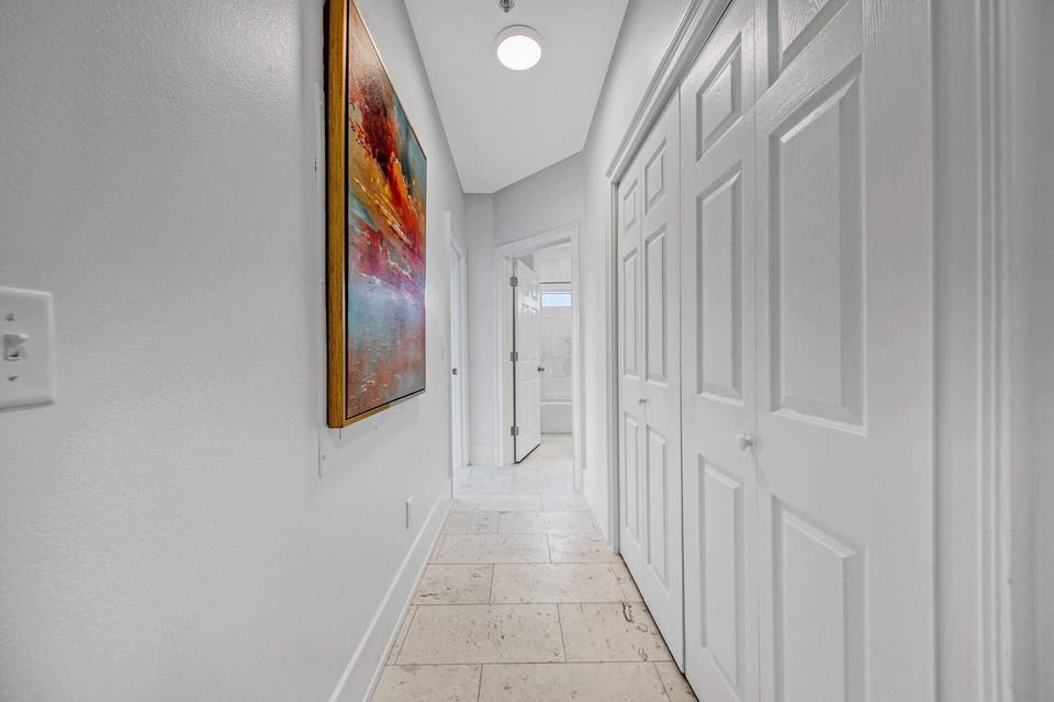 Hallway in between bedrooms and living/kitchen area