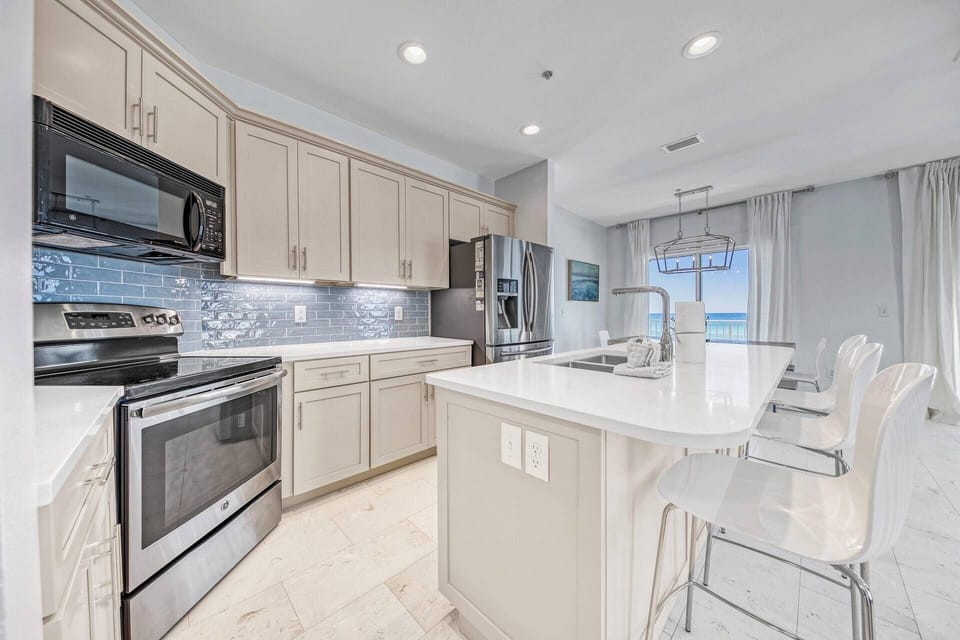 Fully Equipped Kitchen with Quartz Counter-tops with seating at the island for 3