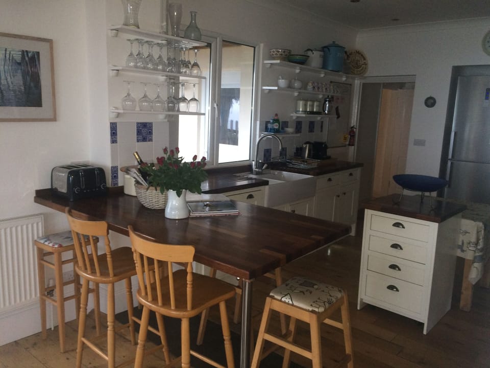 View to the kitchen over the breakfast bar: 2 ovens, MW, DW, WM, double sink, FF