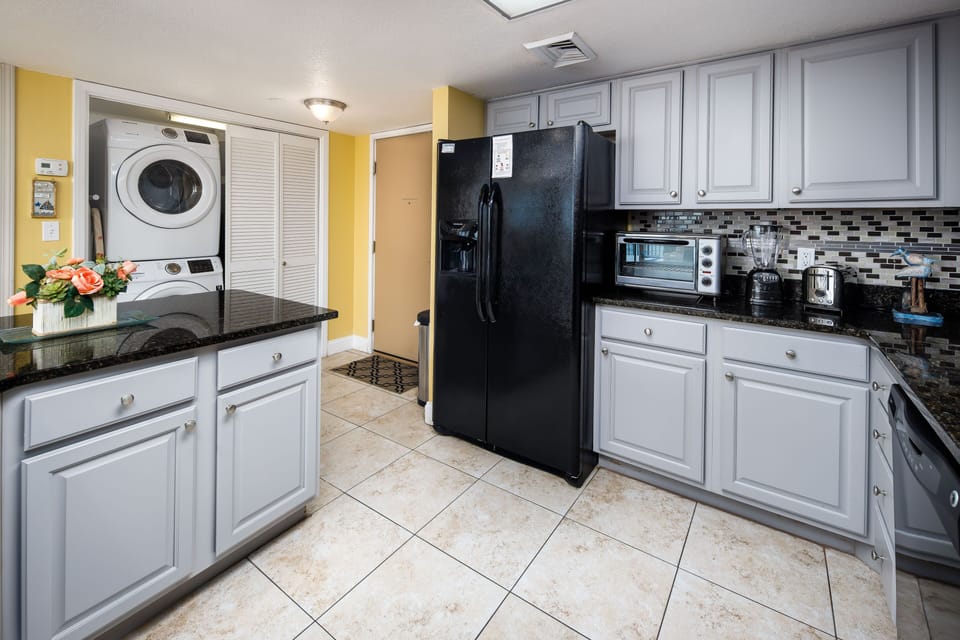 Kitchen and entry with laundry closet