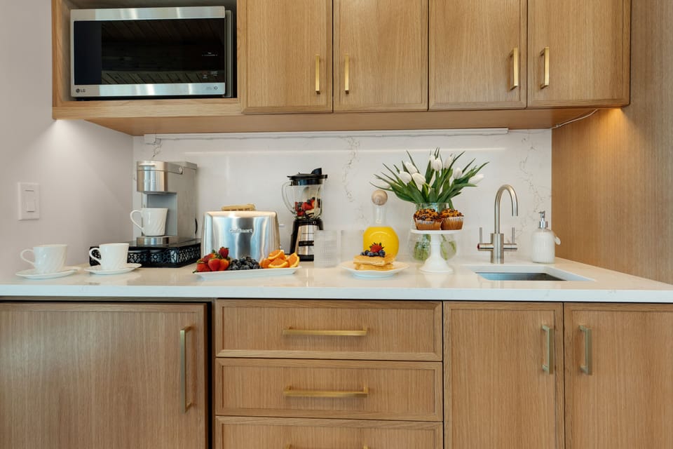 Coffee Bar is complete with beverage fridge, and a filtered water InstaHot tap