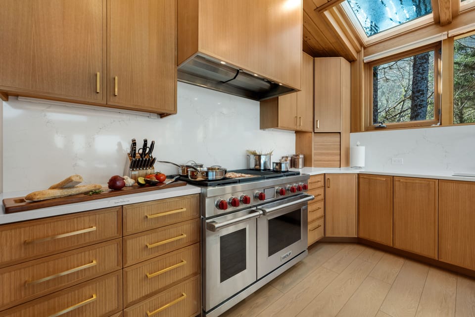 48" Wolf Gas Range.  4 gas burners, griddle and grill with 2 electric ovens.