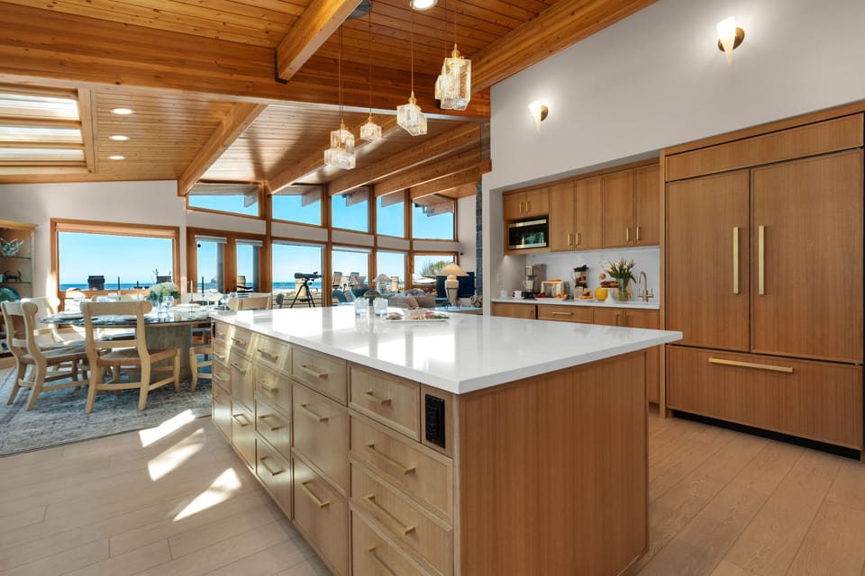 The large island allows everyone to be together for meal prep and conversation  