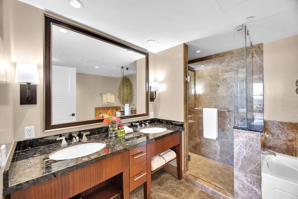 Dual vanities, marble finishes—your private in-room sanctuary