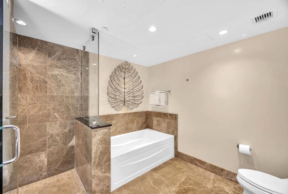 Spa-like master bath with soaking tub and luxe walk-in shower