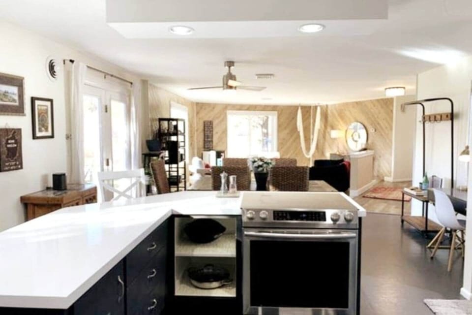 Open kitchen and living area with river views and bright natural light