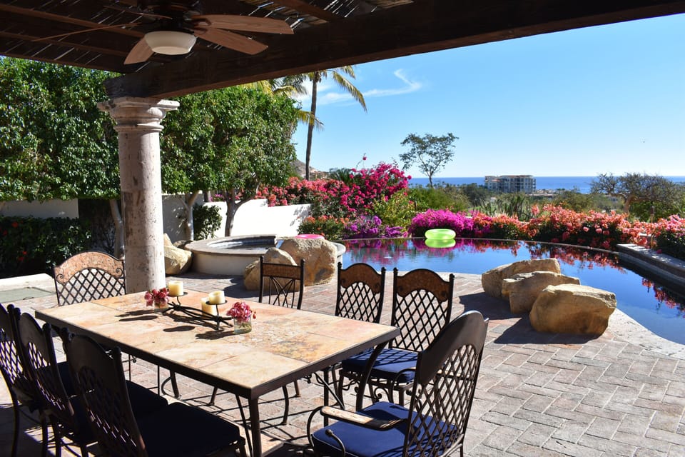 Outdoor Dining Area by the Pool and Hot Tub with Ocean Views