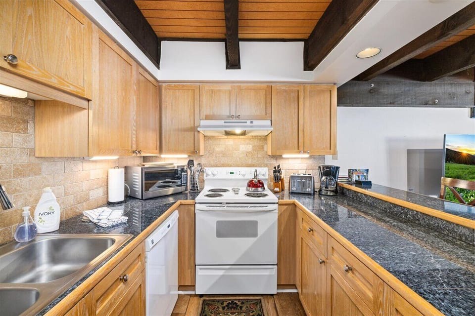Prepare meals in this updated full kitchen with full-size appliances.