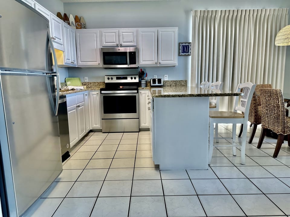 Spacious kitchen with newly painted cabinets!