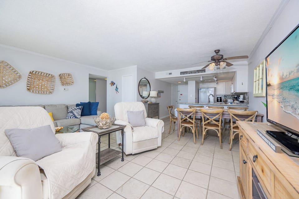 Sink into the comfy armchair, sipping a refreshing drink while enjoying lively chats with family in this inviting space