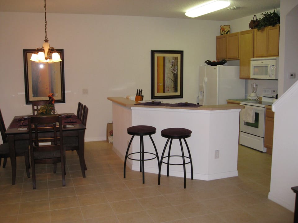 Dining area, breakfast bar and kitchen