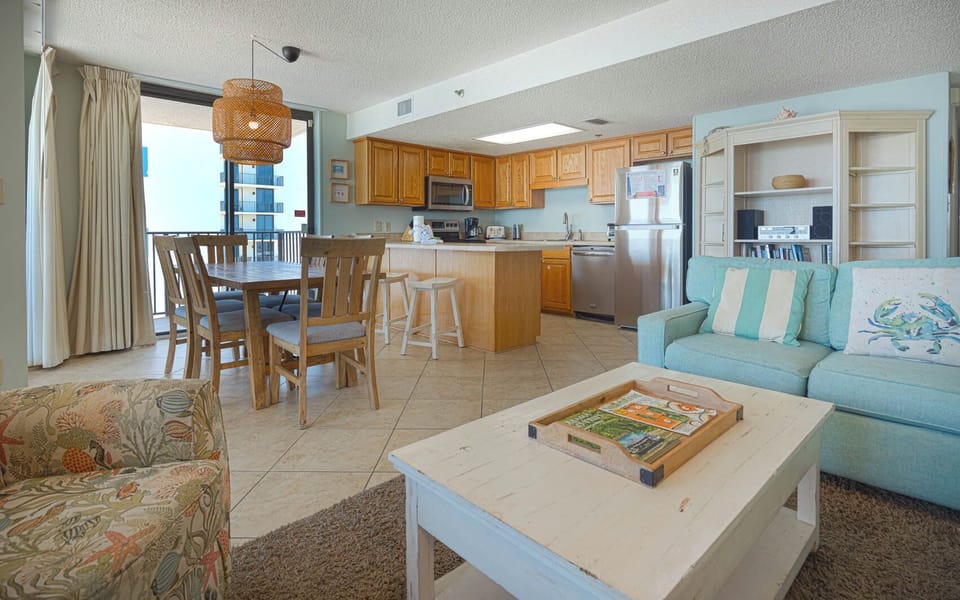 Enjoy the spacious living area with comfortable seating, a dining table, and a view that invites relaxation