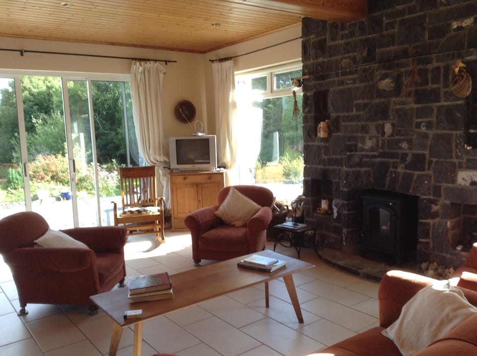 light filled south west facing large living room. wide patio doors to a patio. 