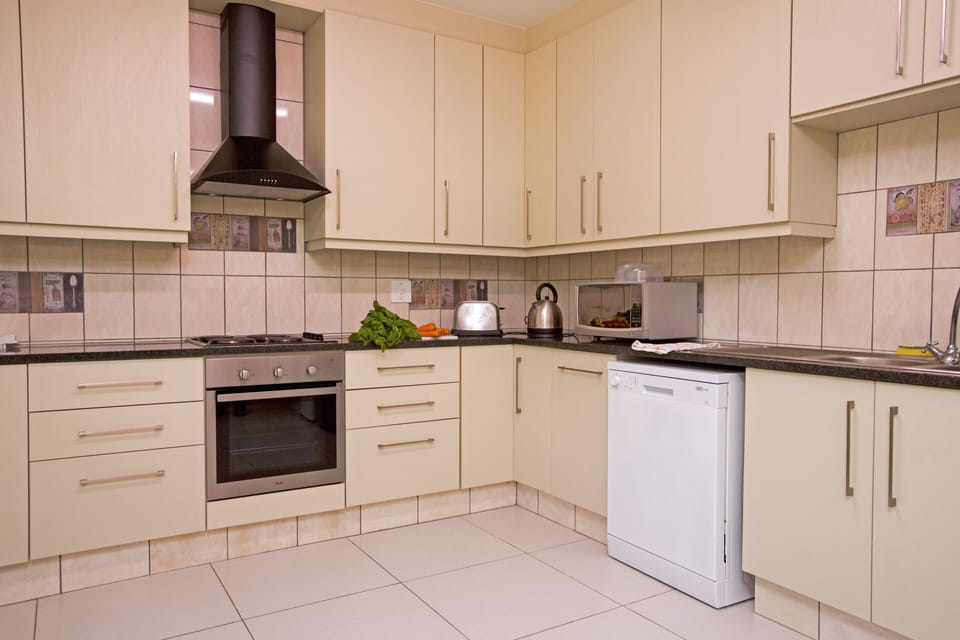 The Kitchen Showing Dishwasher