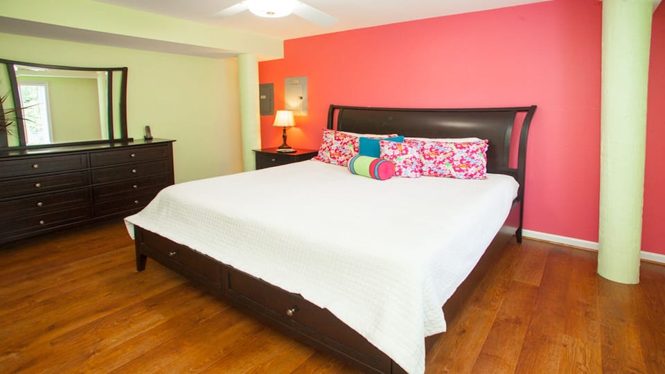 King master bedroom on lower level with en suite and TV.