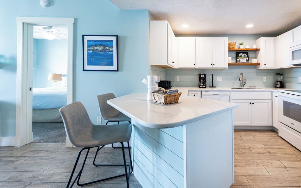 Enjoy the open layout with a sleek kitchen and inviting dining space, perfect for meals and gatherings