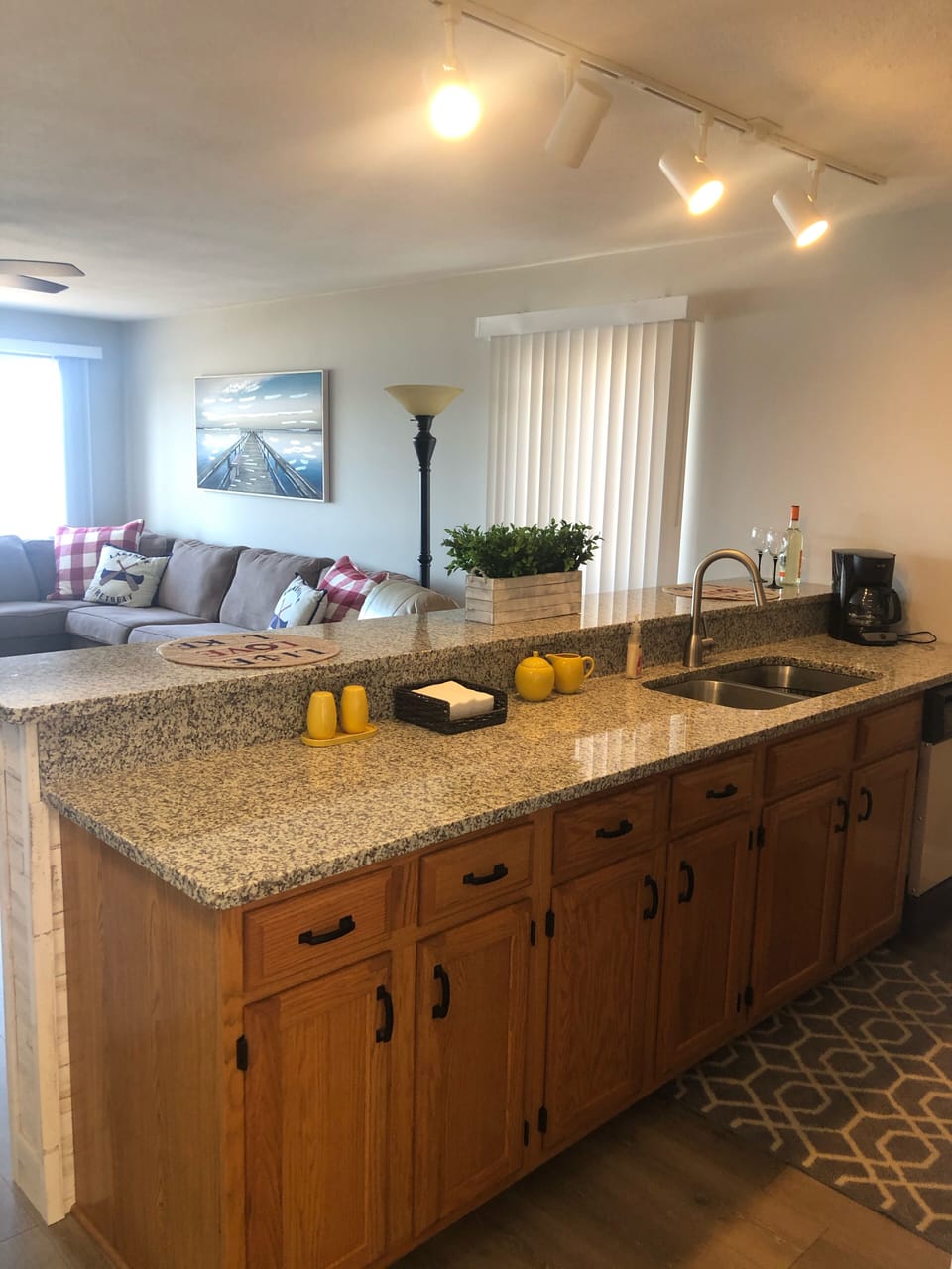 Kitchen open to living area and view of lake and pool!